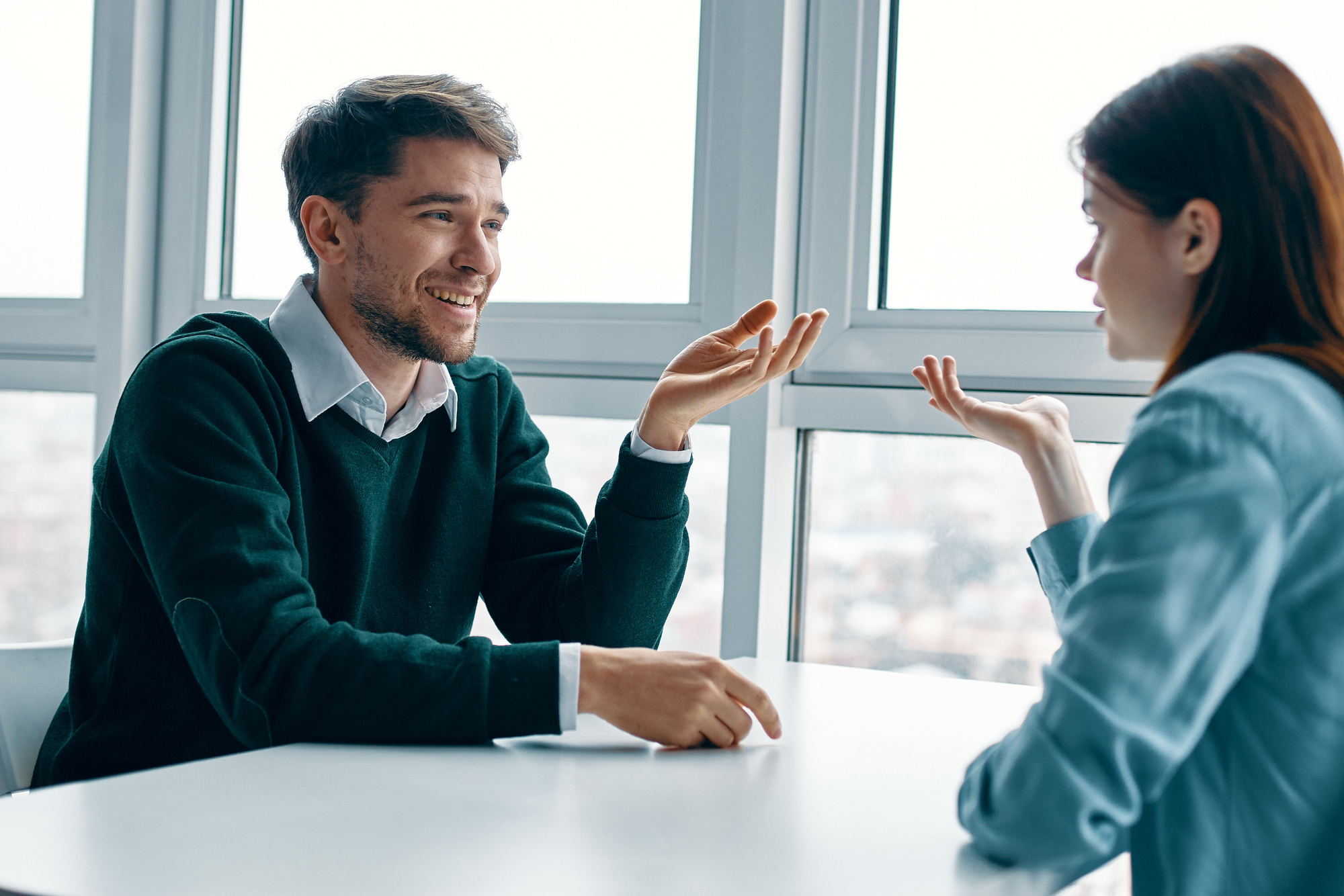 Man and Woman Talking at the Table